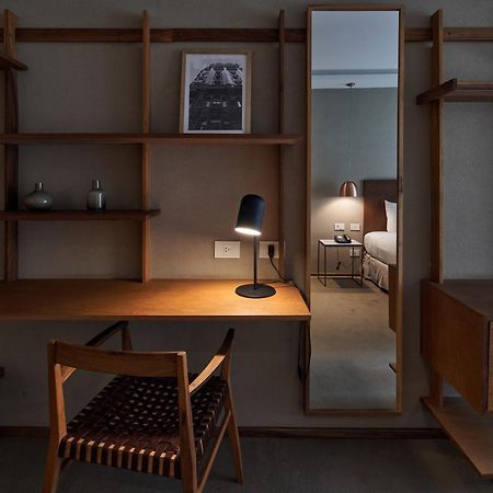 Aq Tailored Suites Buenos Aires Exterior photo A desk in a hotel room