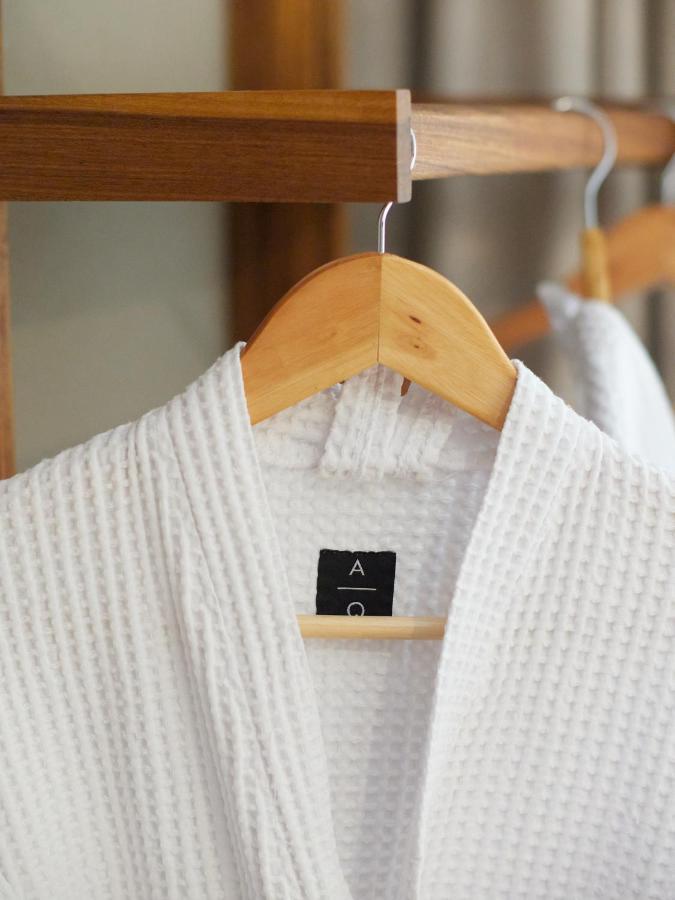 Aq Tailored Suites Buenos Aires Exterior photo A bathrobe