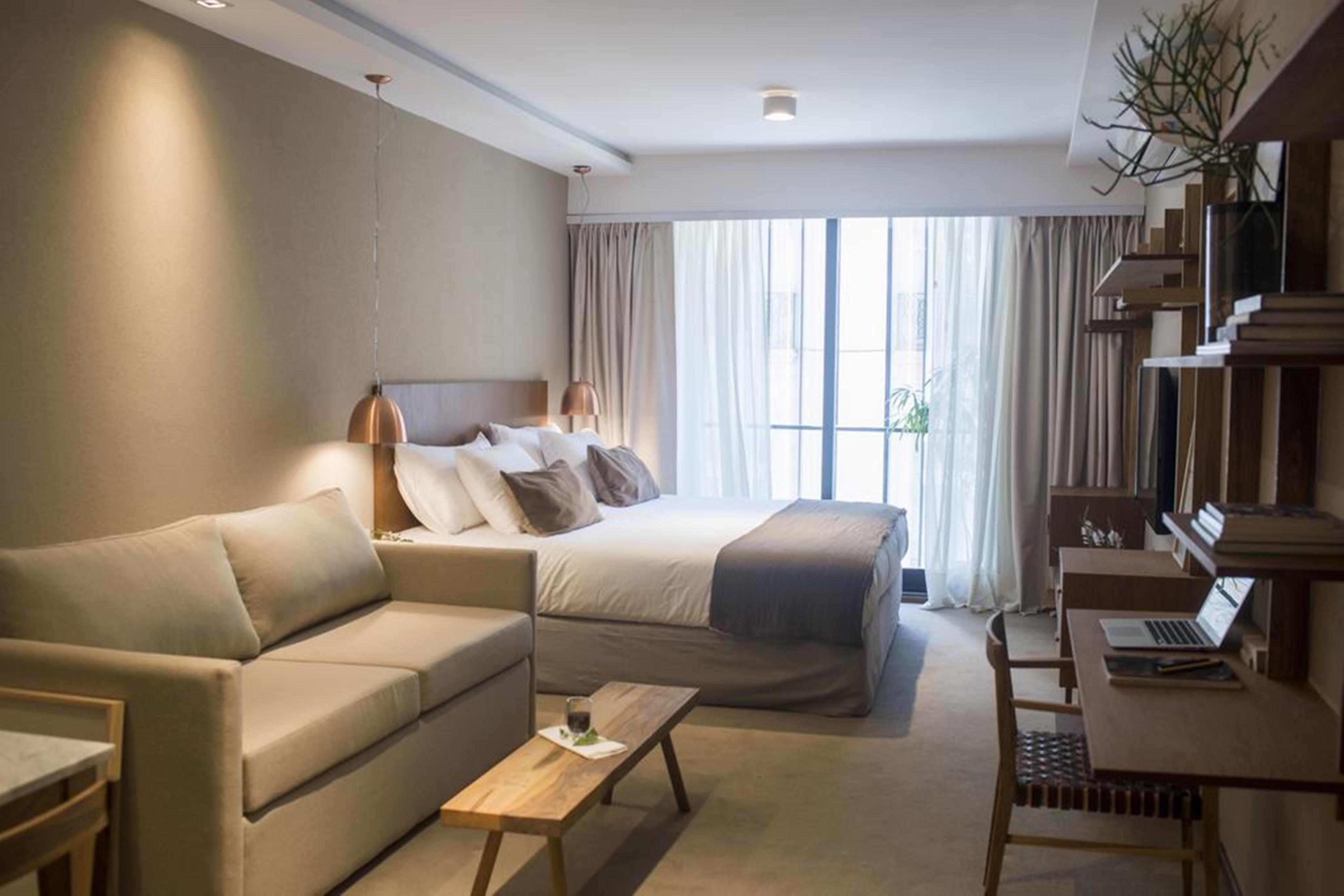 Aq Tailored Suites Buenos Aires Exterior photo A room at the hotel
