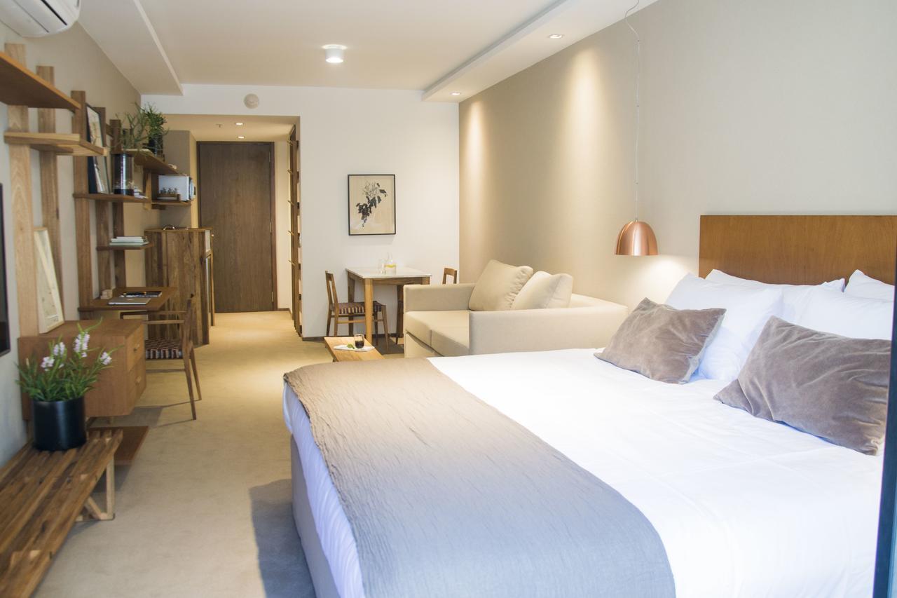Aq Tailored Suites Buenos Aires Exterior photo A typical studio apartment